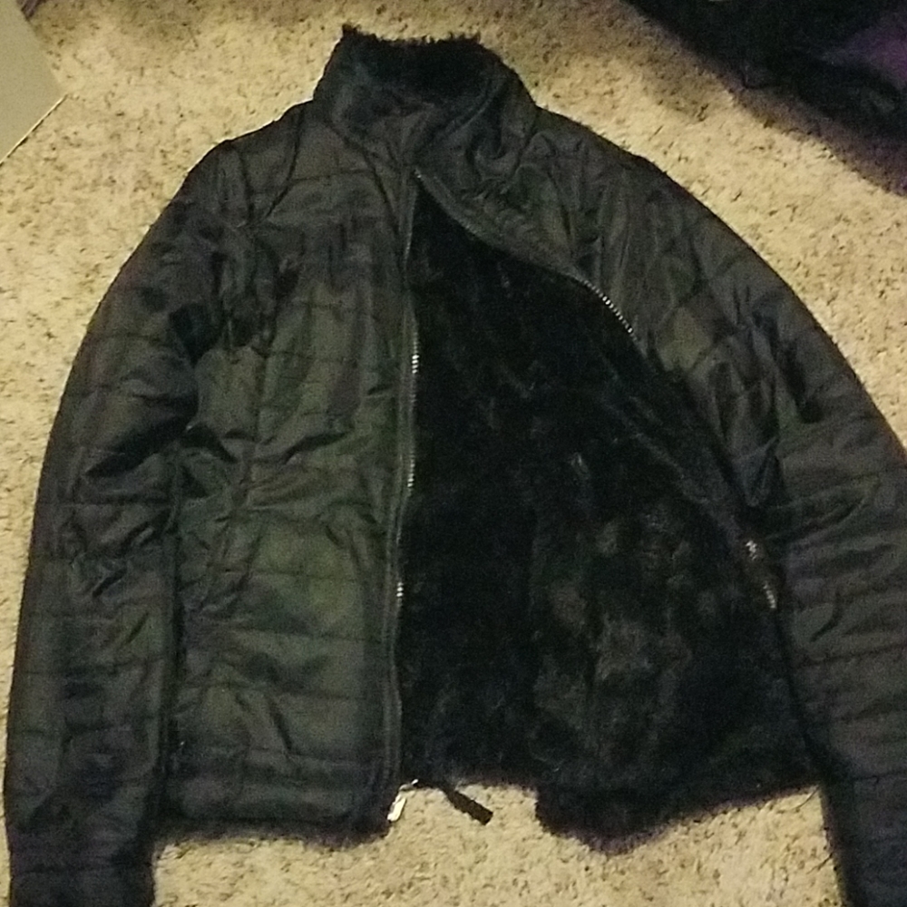 A black winter jacket with a fluffy inside